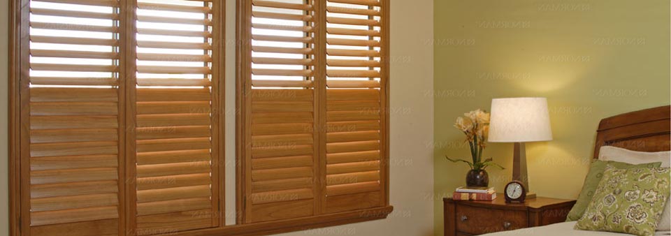 Medium Wood Plantation Shutters In Bedroom