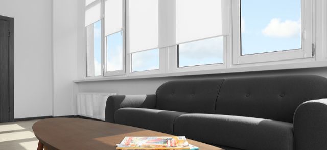 Solar Shades On A Large Window In A Living Room.